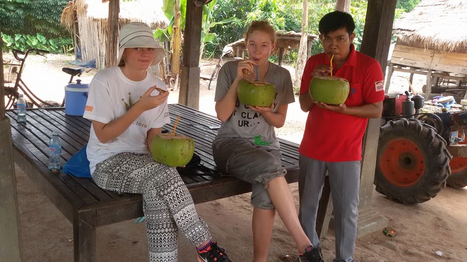 drinking fresh coconuts with friends