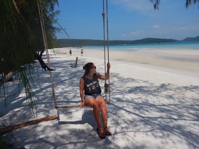 at the beach on a swing