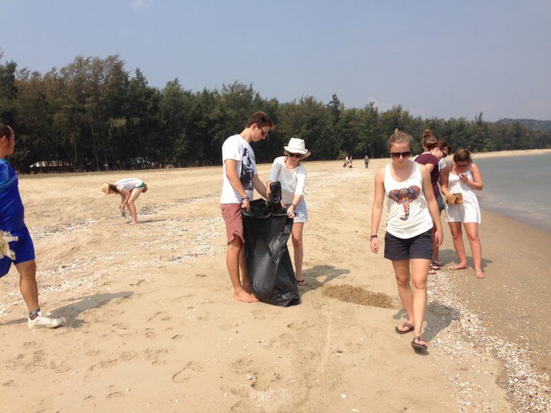 volunteers cleaning up the beach in thailand