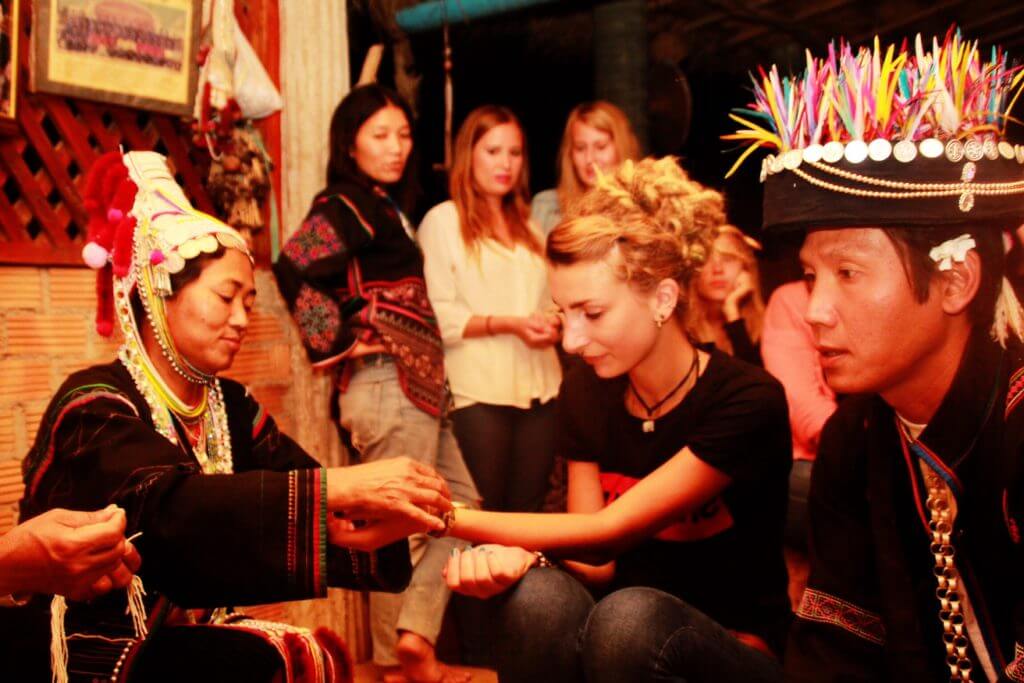 volunteers receiving bracelets as a gesture of goodwill