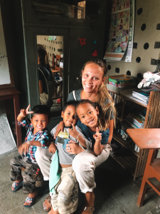 Kindergarten children with Georgina the IVI volunteer