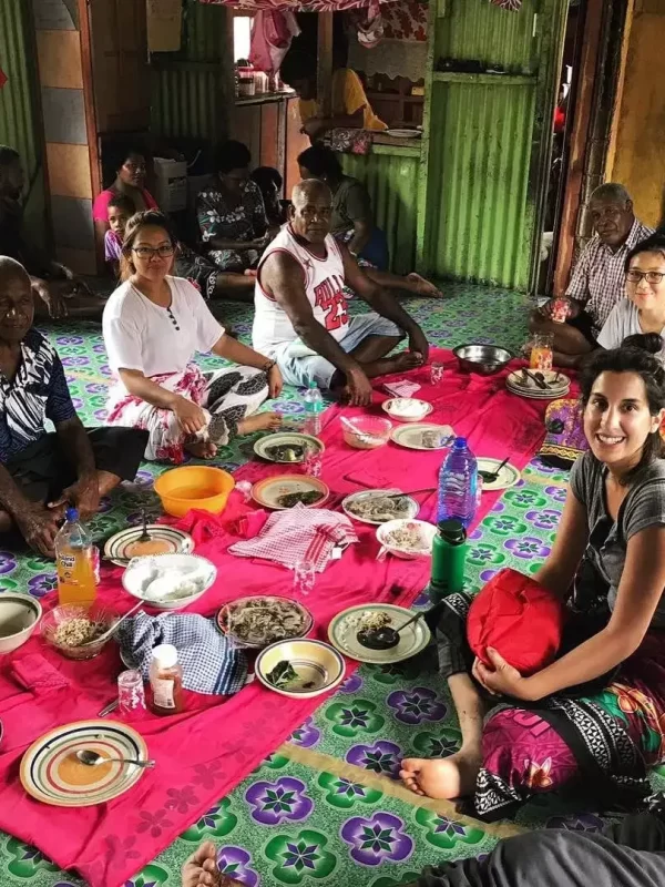 Volunteer-in-fiji-sitting-with-villagers-having-talk-about-nutrition