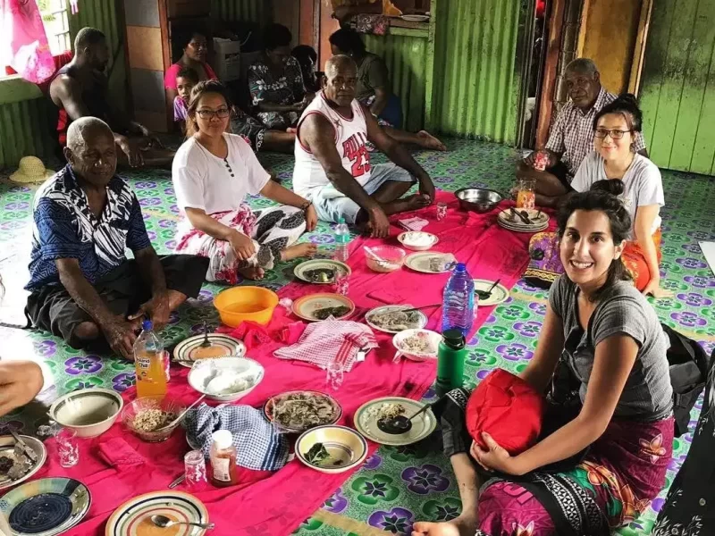 Volunteer-in-fiji-sitting-with-villagers-having-talk-about-nutrition