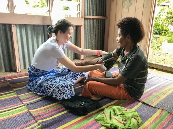 Volunteer taking blood pressure