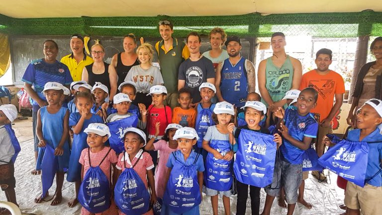 IVI Volunteers with group of children in Fiji