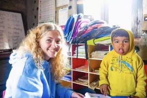 IVI-volunteer-with-young-child-in-Nepal