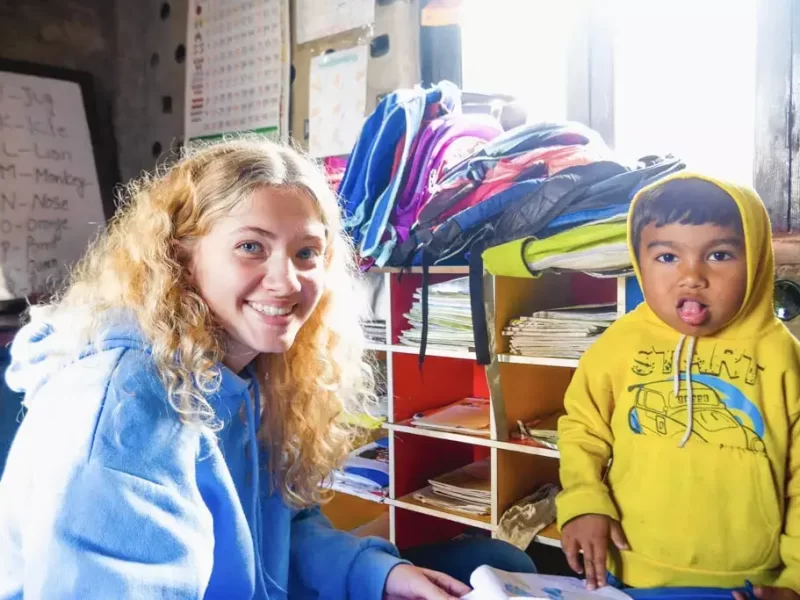 IVI-volunteer-with-young-child-in-Nepal