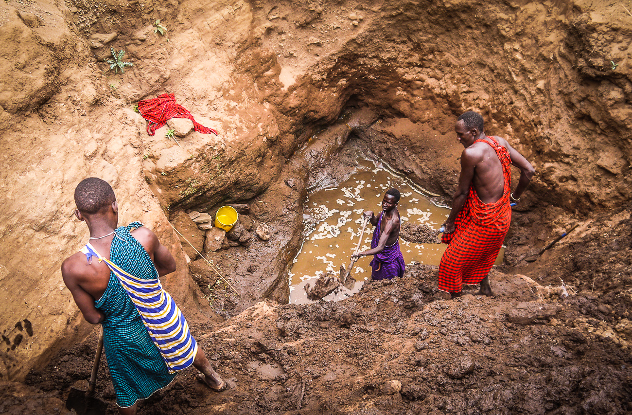 men digging for water