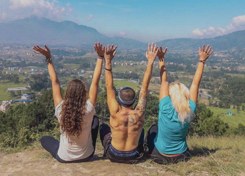 sitting on top of a hill overlooking countryside