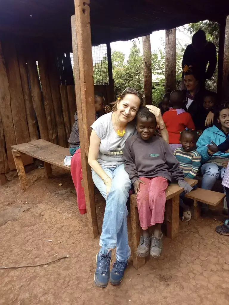 sitting with local children at the school-2