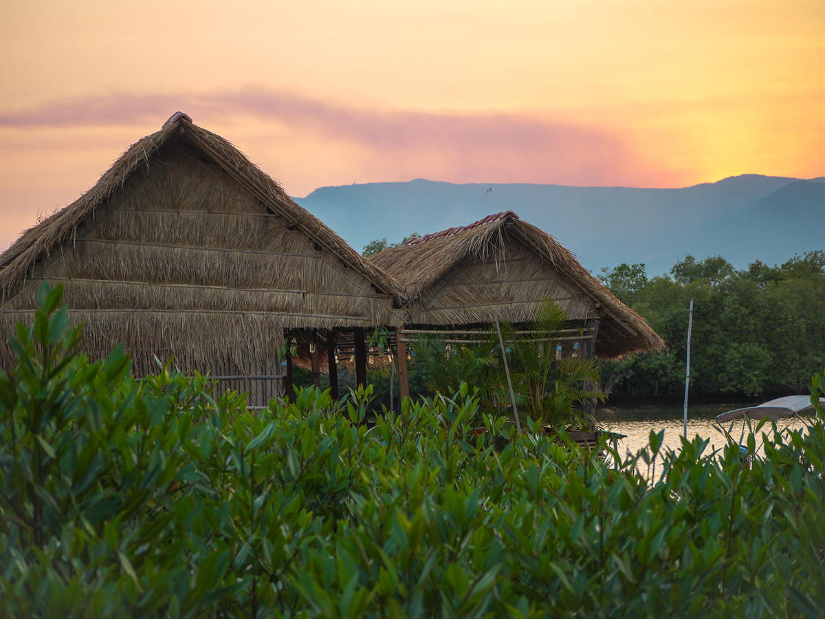 straw huts and beautiful sunset