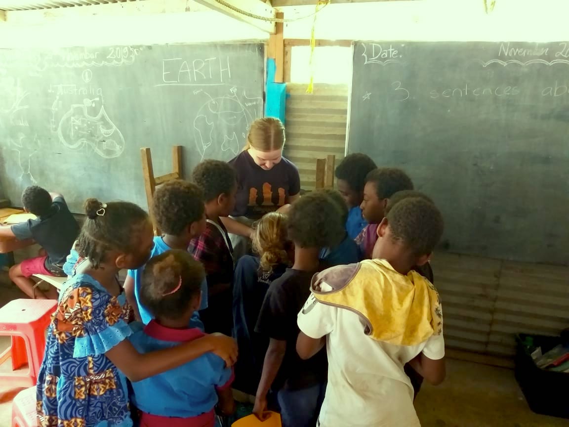 teacher checking students work