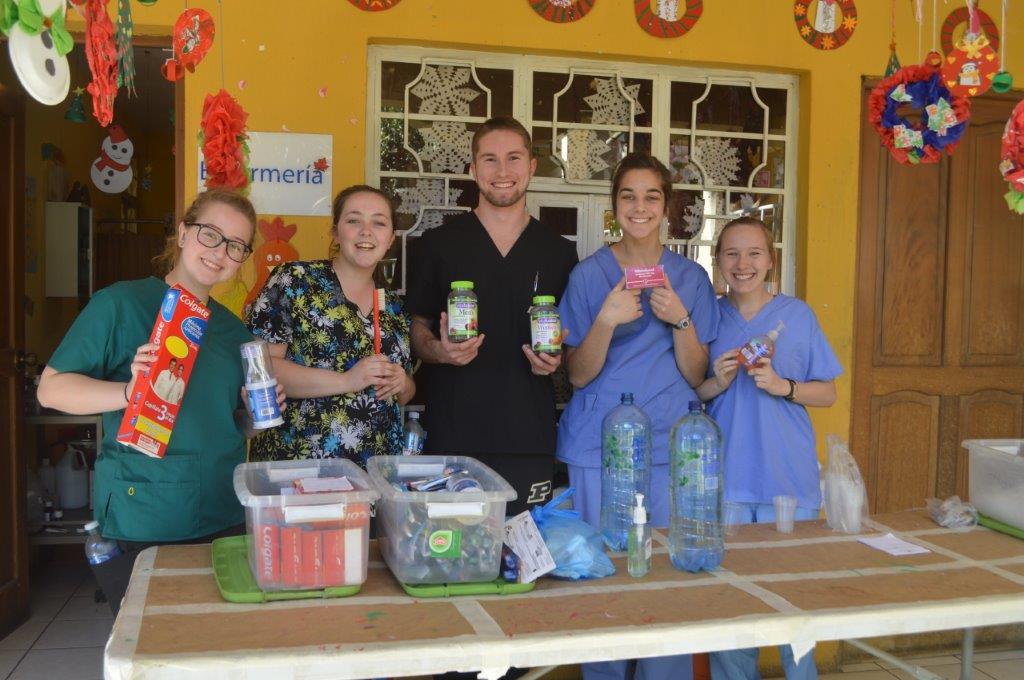 group holding medical supplies