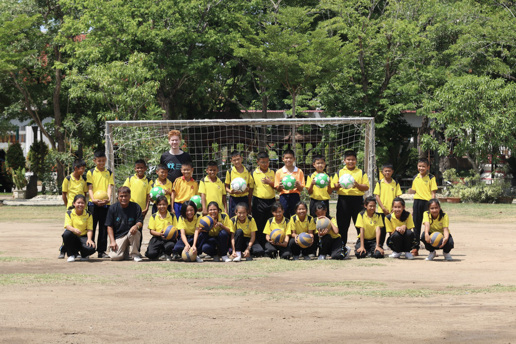 Group photo of coach with students