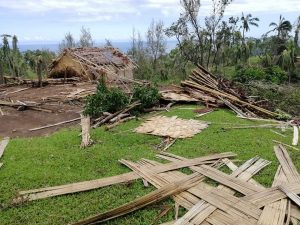 walls of straw house sprawled on grass