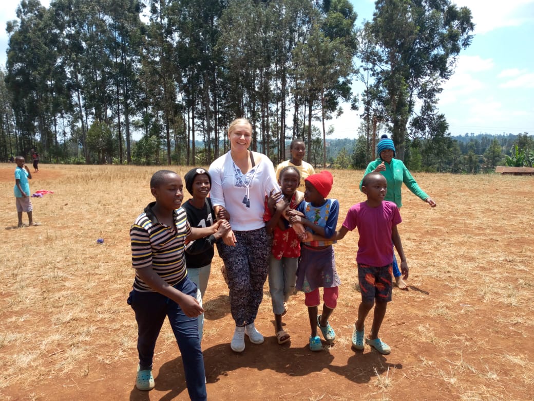 Participant with students during break time