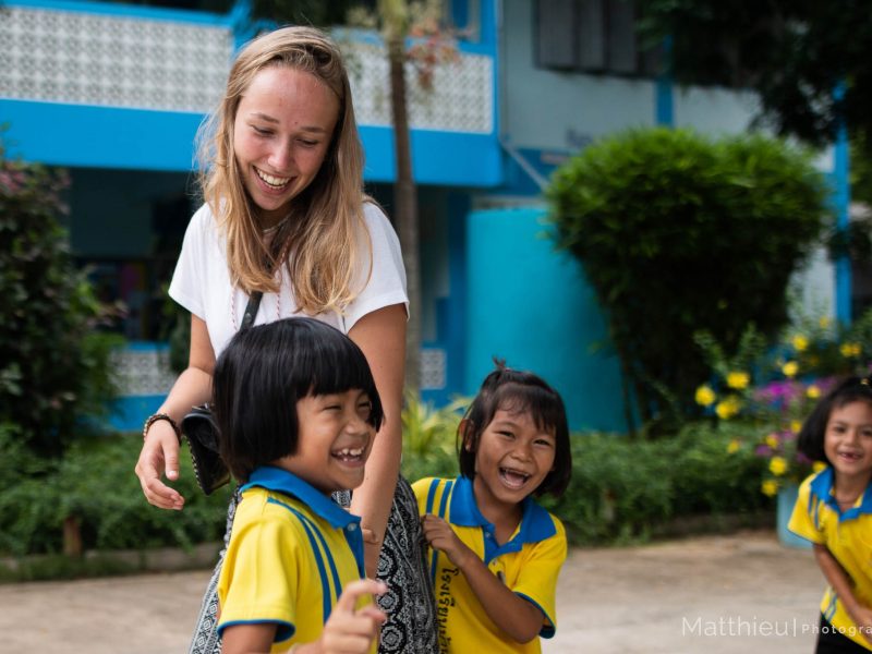 Participant playing with students during break time