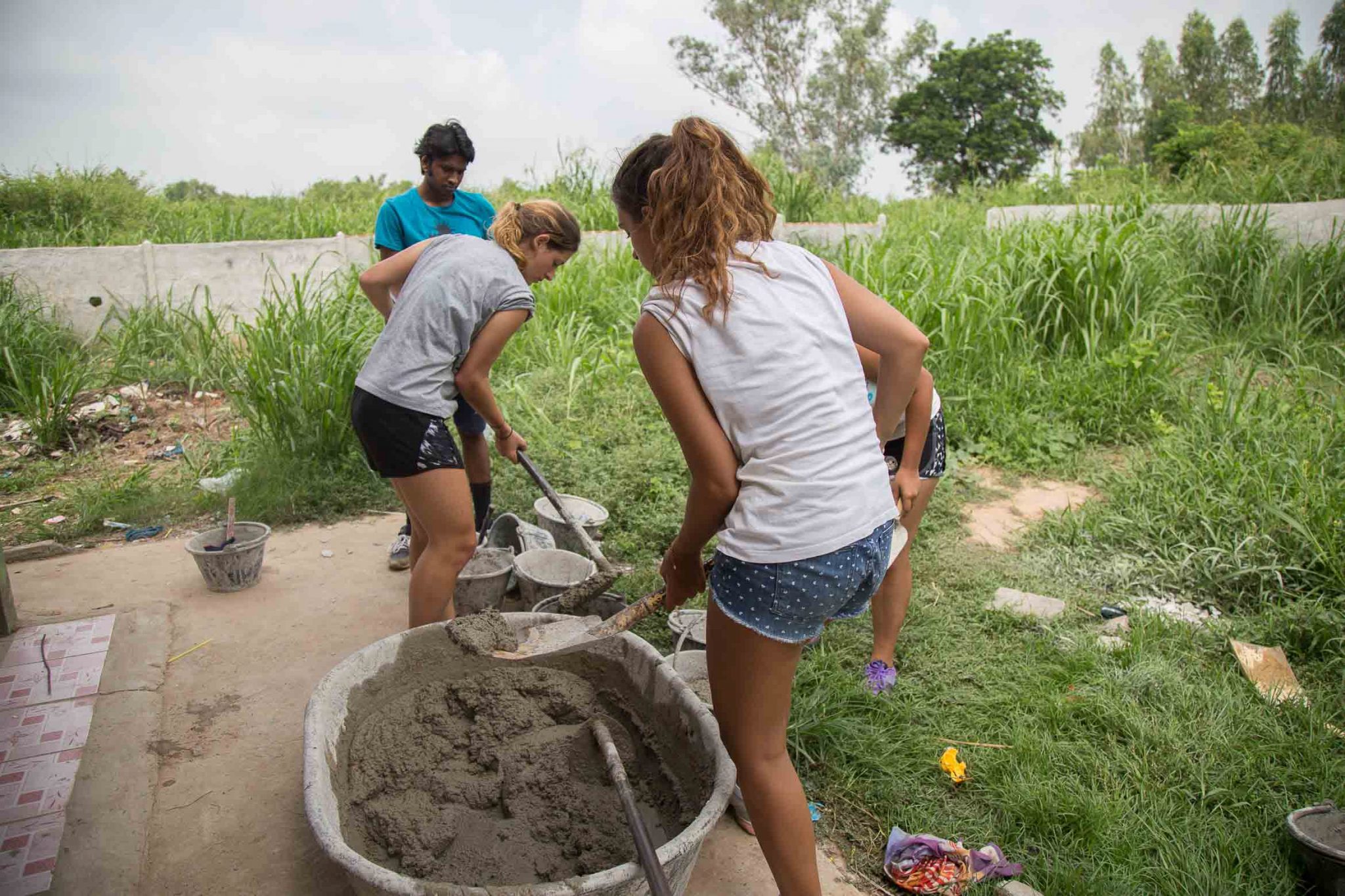 Putting cement in buckets