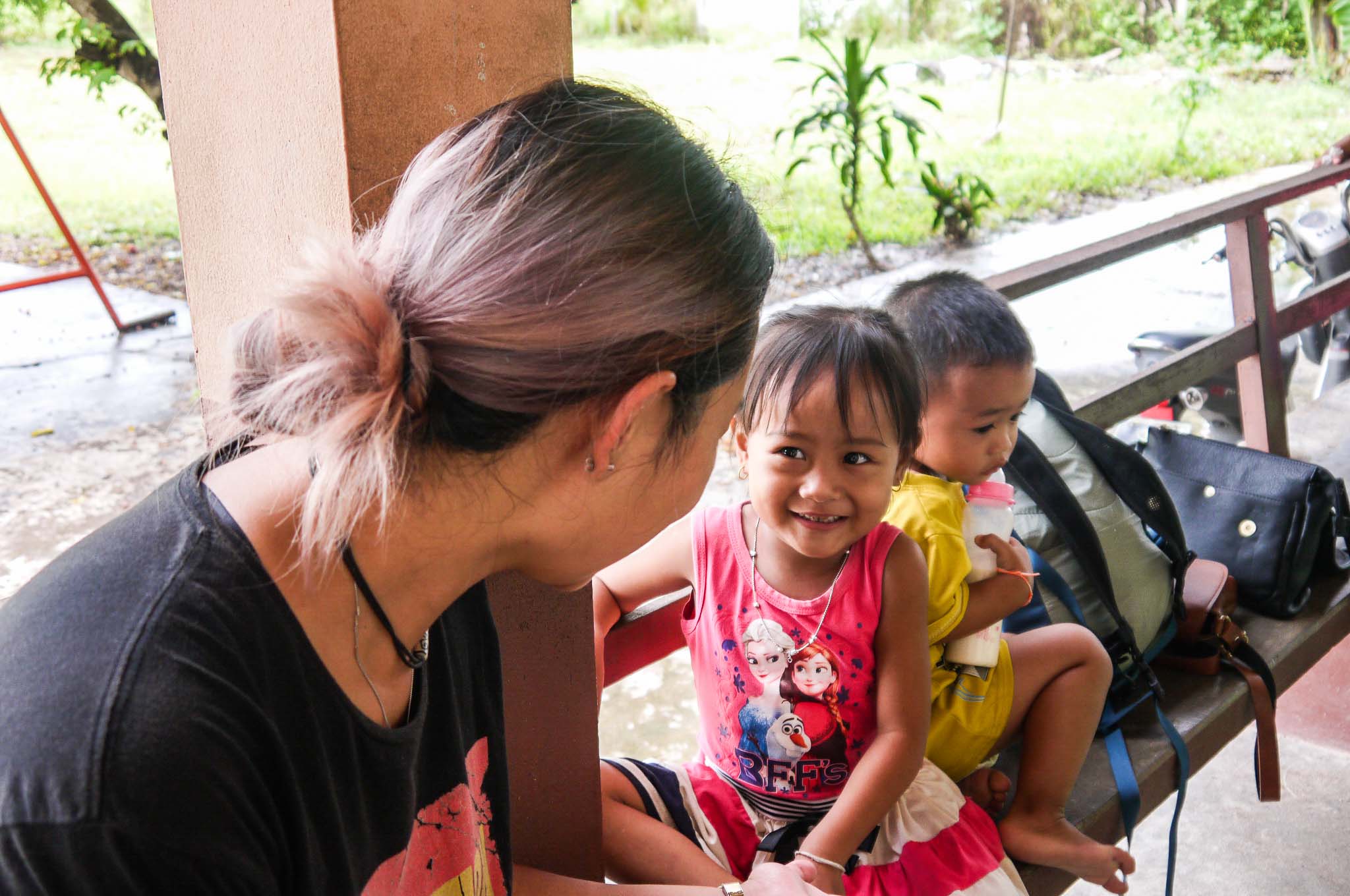 Participant talking to two kids