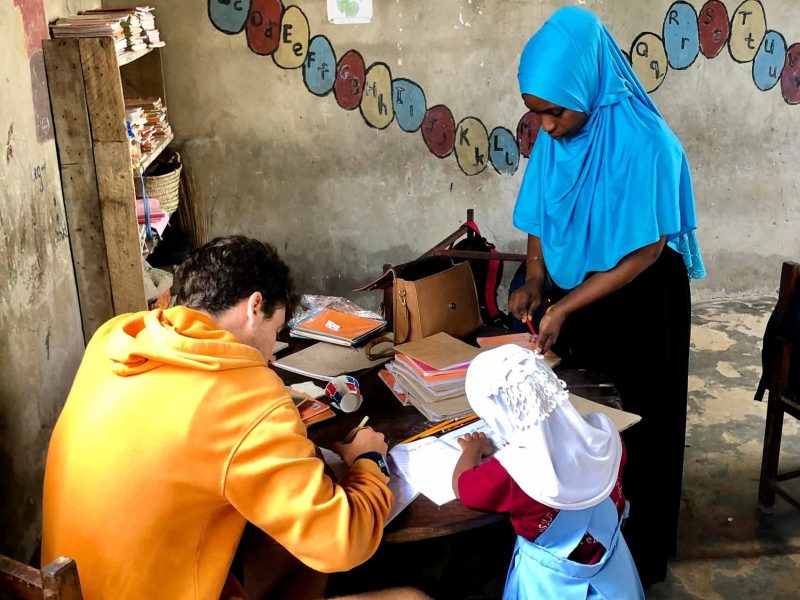 volunteer checking kids work