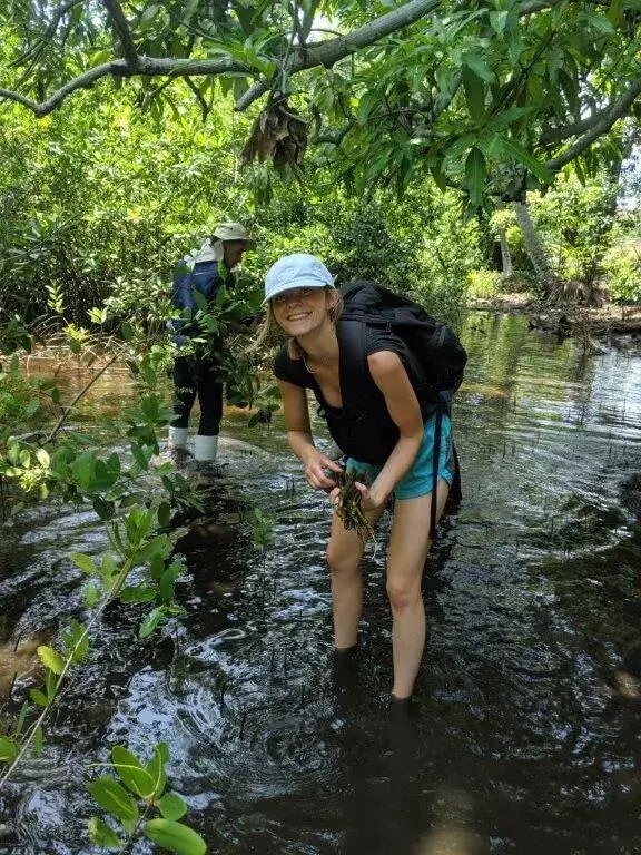 girl standing in river