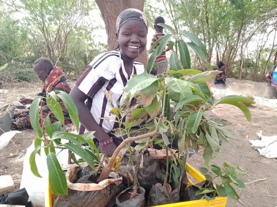 child with plant