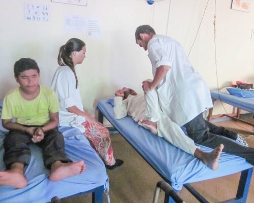 Physiotherapist intern assisting person in nepal