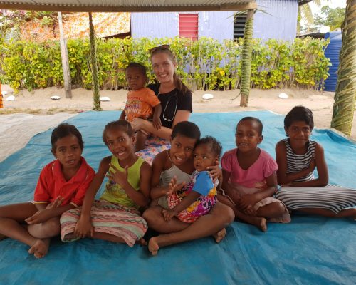 Beth franks with the children in the village in fiji