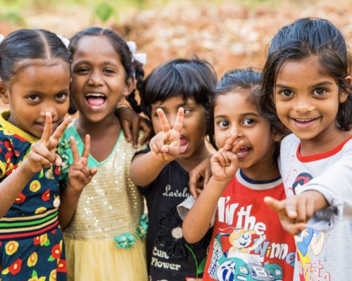 group of young kids smiling at camera