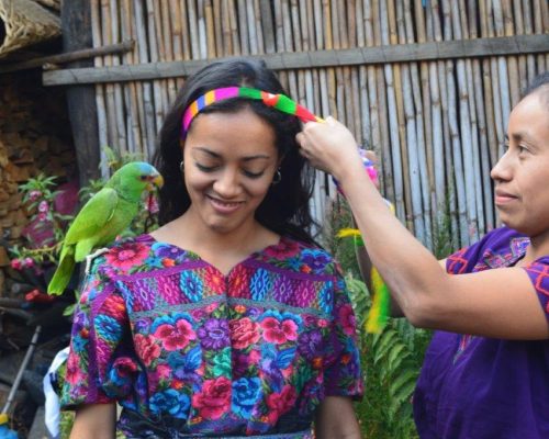 girl with parrot on her shoulder