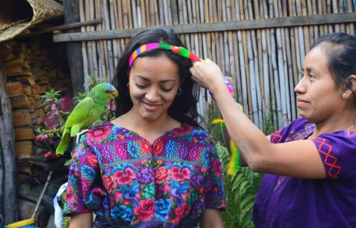 girl with parrot on her shoulder