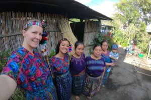 standing with host family in traditional dress