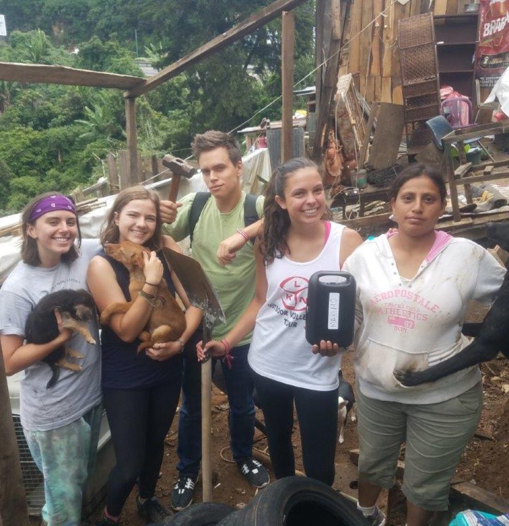 group posing with some of the dogs