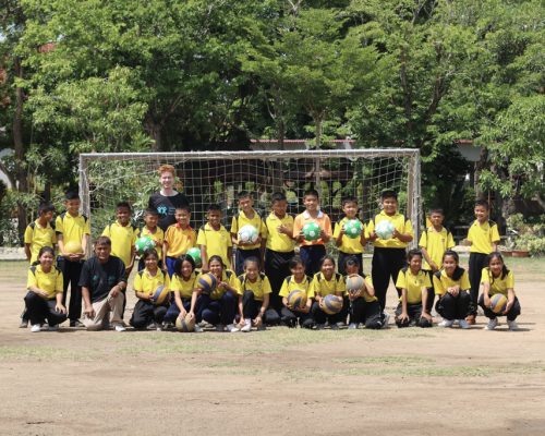 Group photo of coach with students