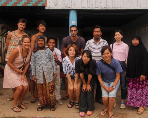 Group photo of participants with locals