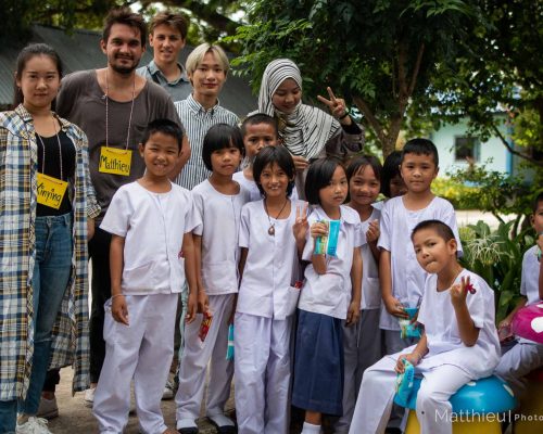 Group photo of participants with students