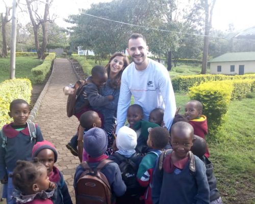 volunteers with Tanzanian students