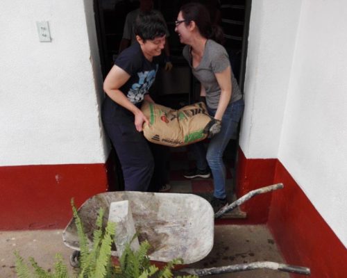 carrying a bag of cement