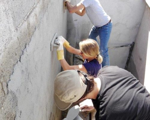 layering cement on wall