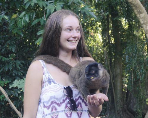 IVI volunteer holding lemur