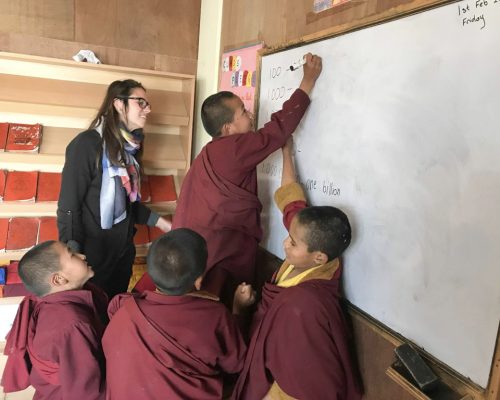 monks writing on board