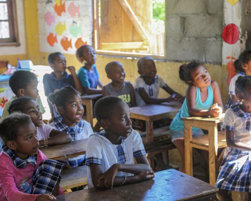 kids at desks in classroom