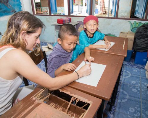 Participant drawing with student