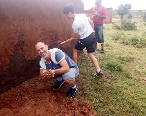 Participant helping maasai people building a new house for bride (1)