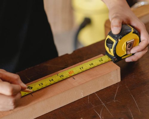 _Participant measuring wood fittings