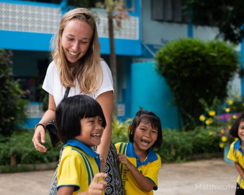 Participant playing with students during break time