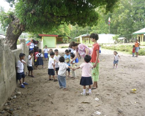 Participants playing with students