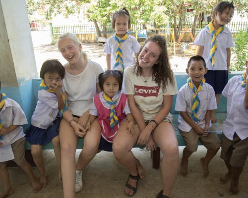 Participants with students during break time