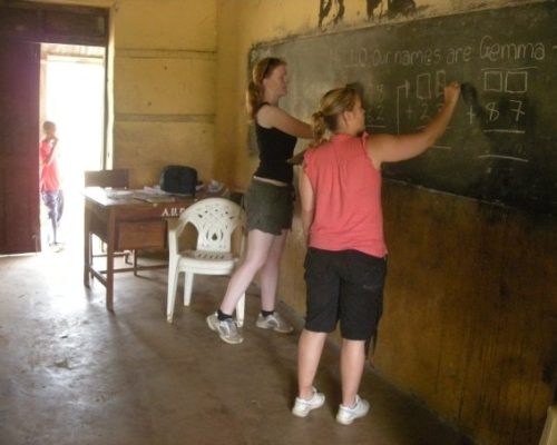 Participants writing on a chalkboard