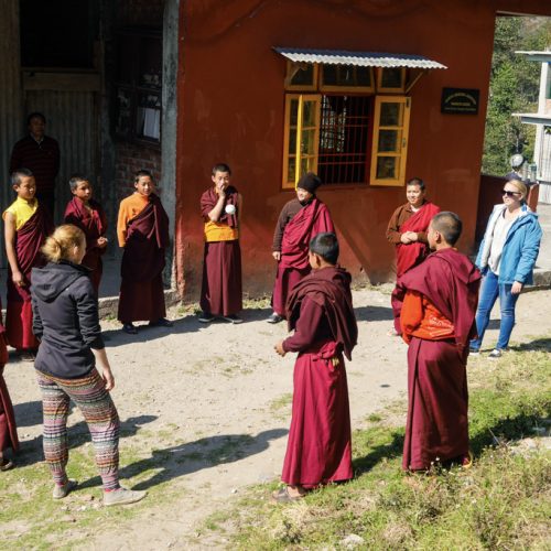 standing in a circle with the monks